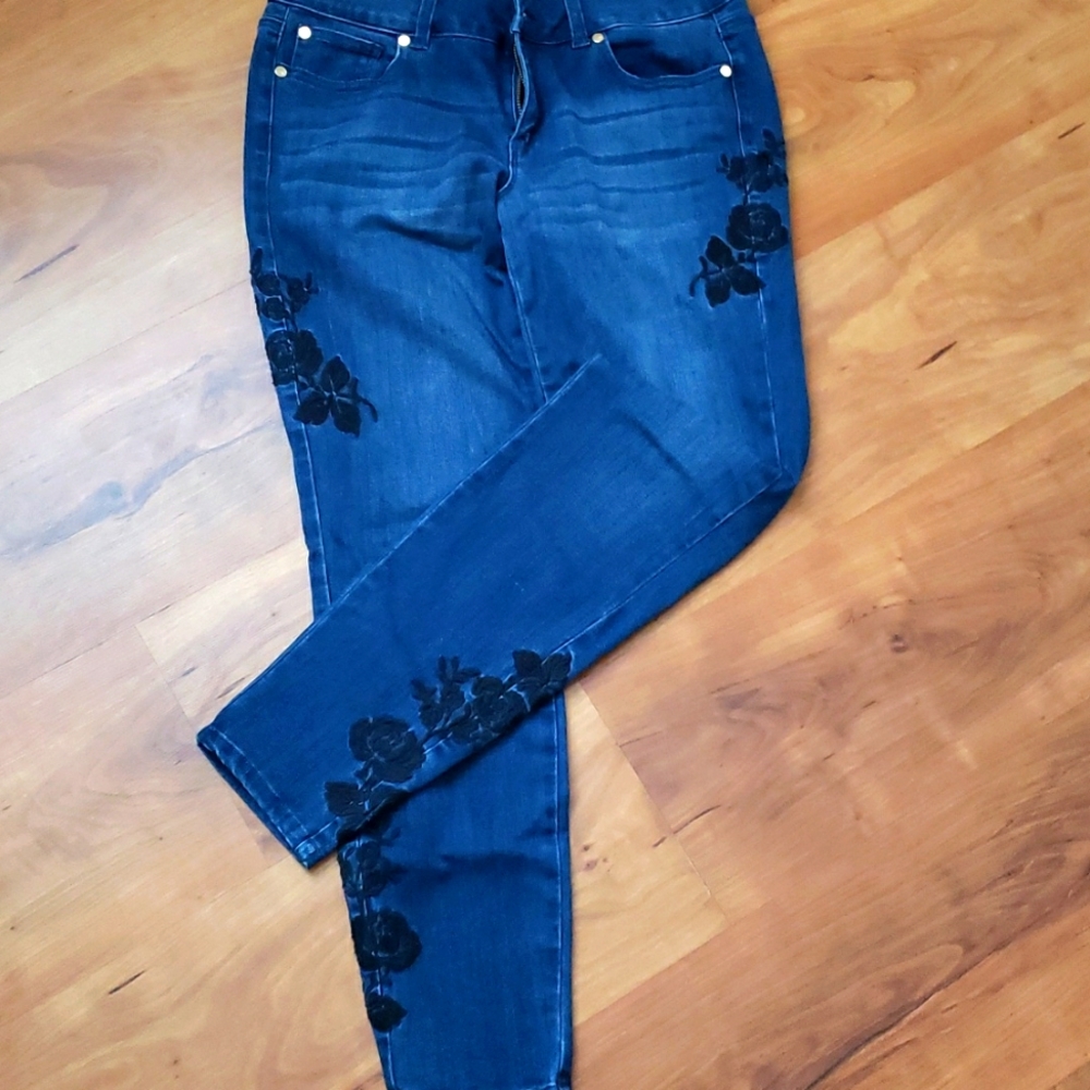 Blue jeans with black rose embroidery